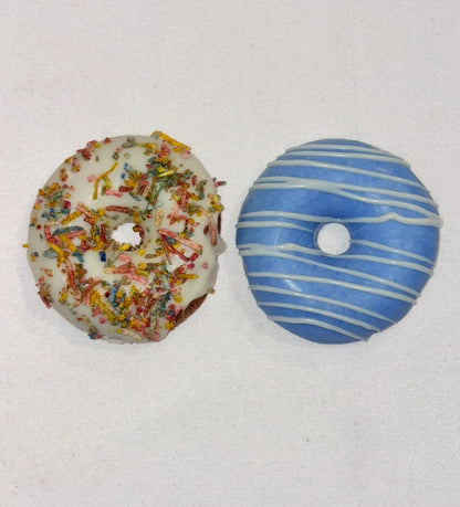 Dog Doughnut, one with colourful sprinkles and the other with blue and white stripes, on a light gray background.