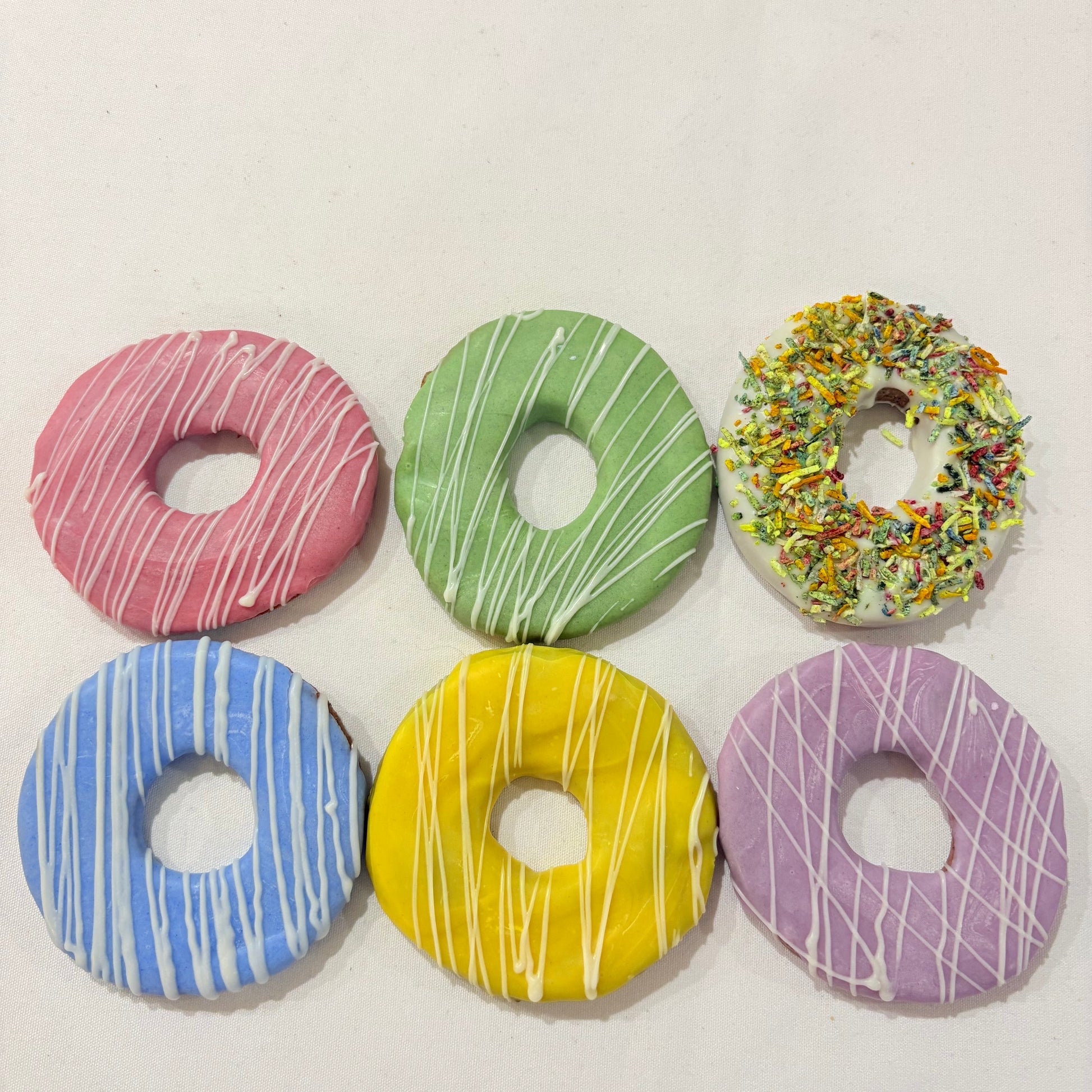 Colorful donut-shaped cookies on a white background