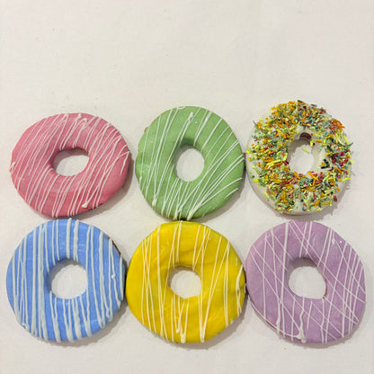 Colorful donut-shaped cookies on a white background